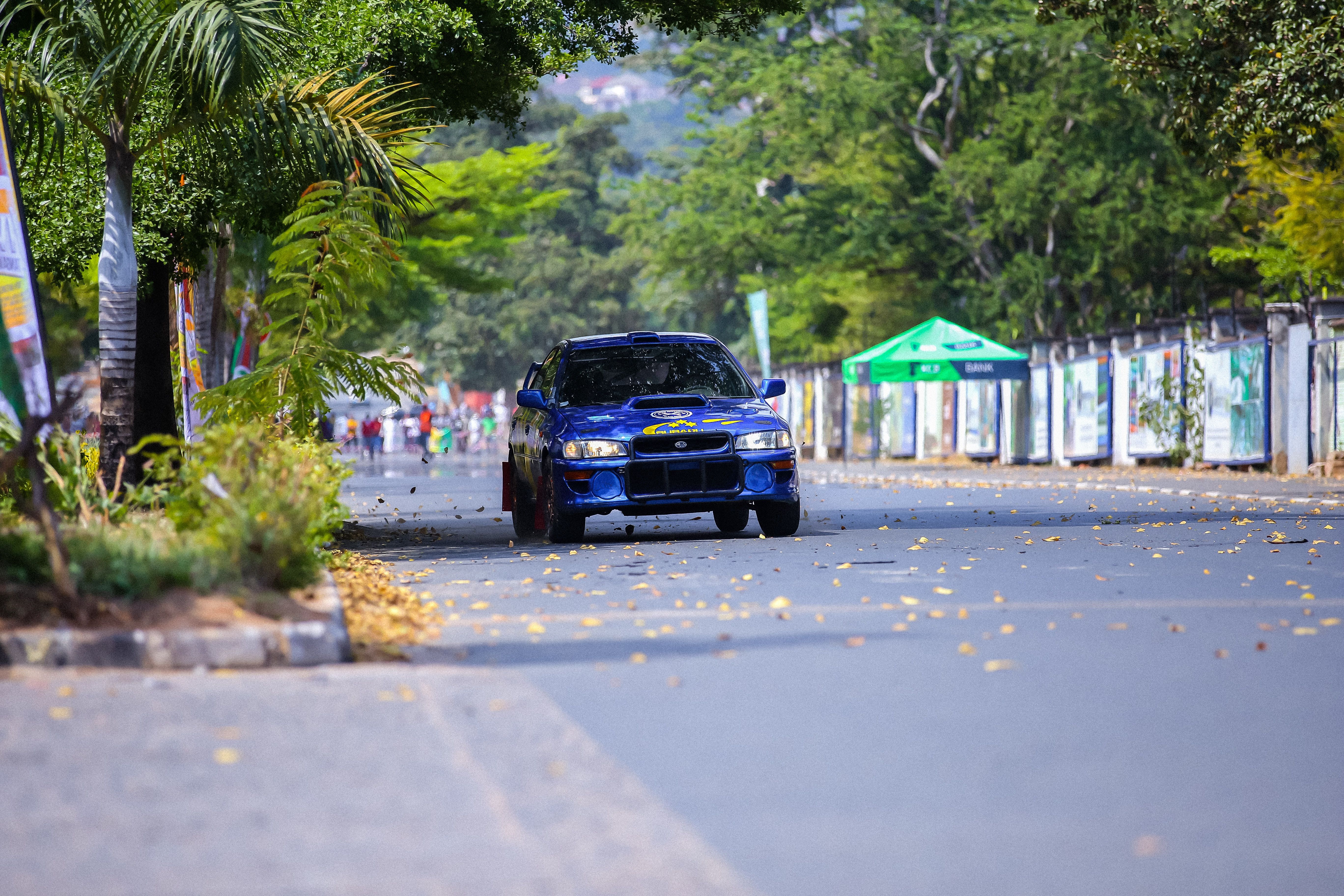 Blue Sports Car Racing on the Road in a City · Free Stock Photo