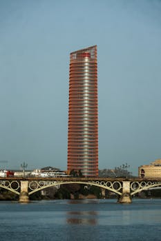 Modern architectural marvel, Torre Sevilla, piercing the sky in Seville with a stunning cityscape view.