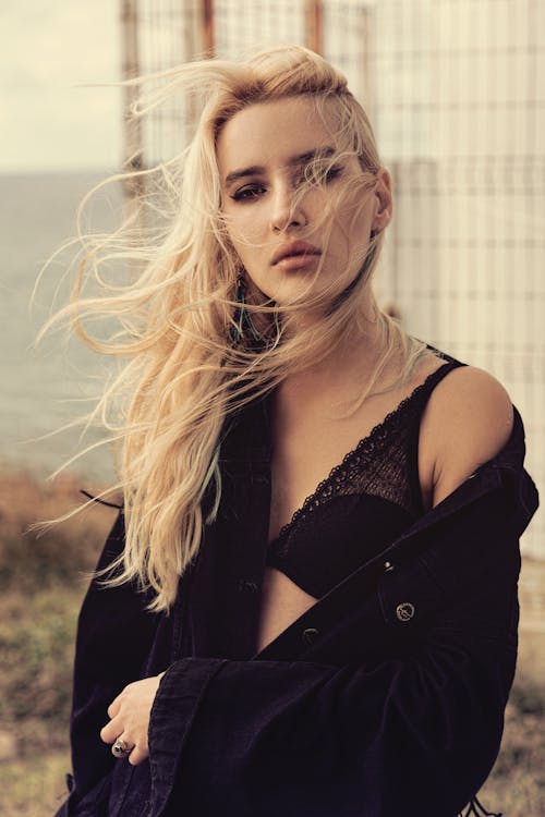 Blonde Woman in Black with Tousled Hair