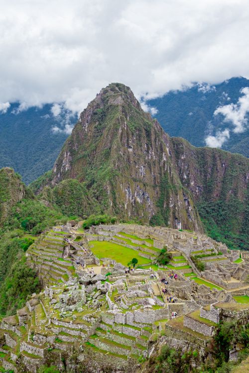 Free Explore the ancient ruins of Machu Picchu, Peru, set against dramatic mountain landscapes. Stock Photo