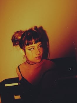 A cinematic portrait of a woman with warm tones and shadows, evoking a retro vibe.