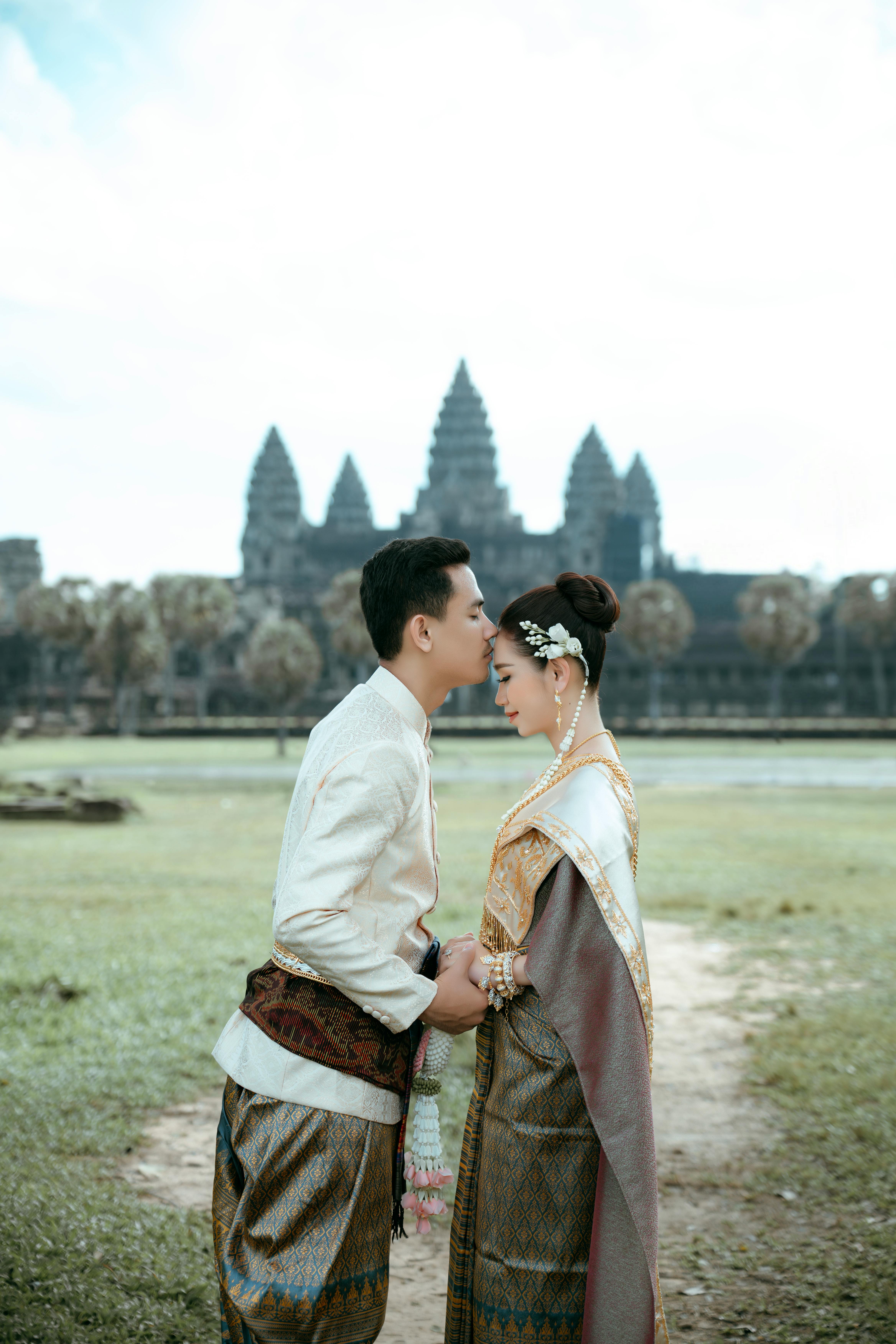 free-photo-of-a-couple-in-traditional-clothing-standing-in-front-of-a-temple.jpeg?auto\u003dcompress\u0026cs\u003dtinysrgb\u0026dpr\u003d1\u0026w\u003d500