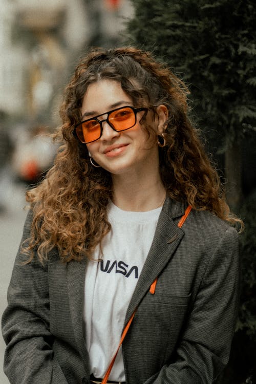 Portrait of Woman Wearing Orange Tinted Glasses