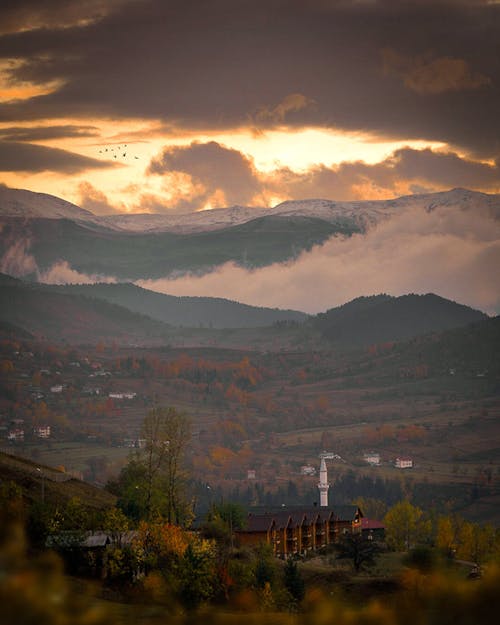 Clouds over Valley in Autumn at Sunset