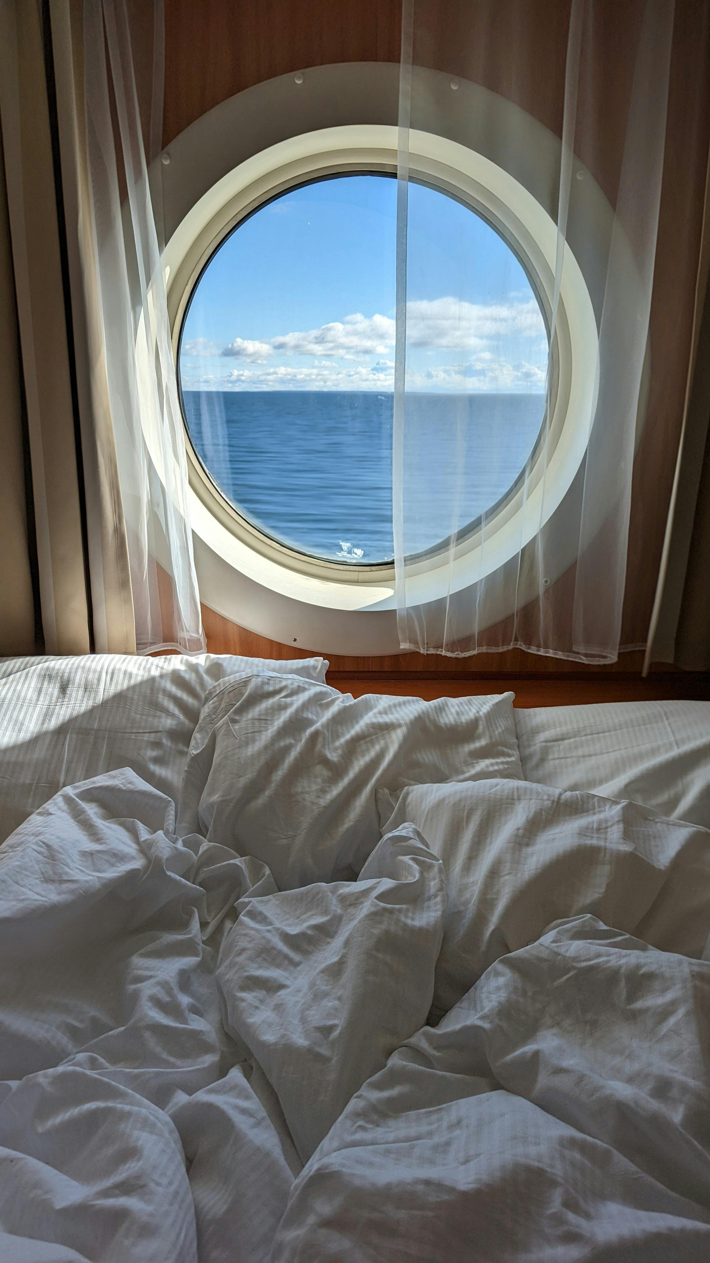 Luxurious cruise ship cabin with sea view. Relaxing ambiance for perfect getaway.