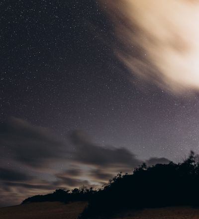 Star field over a dark ridge line, photo by Jonathan Borba on Pexels