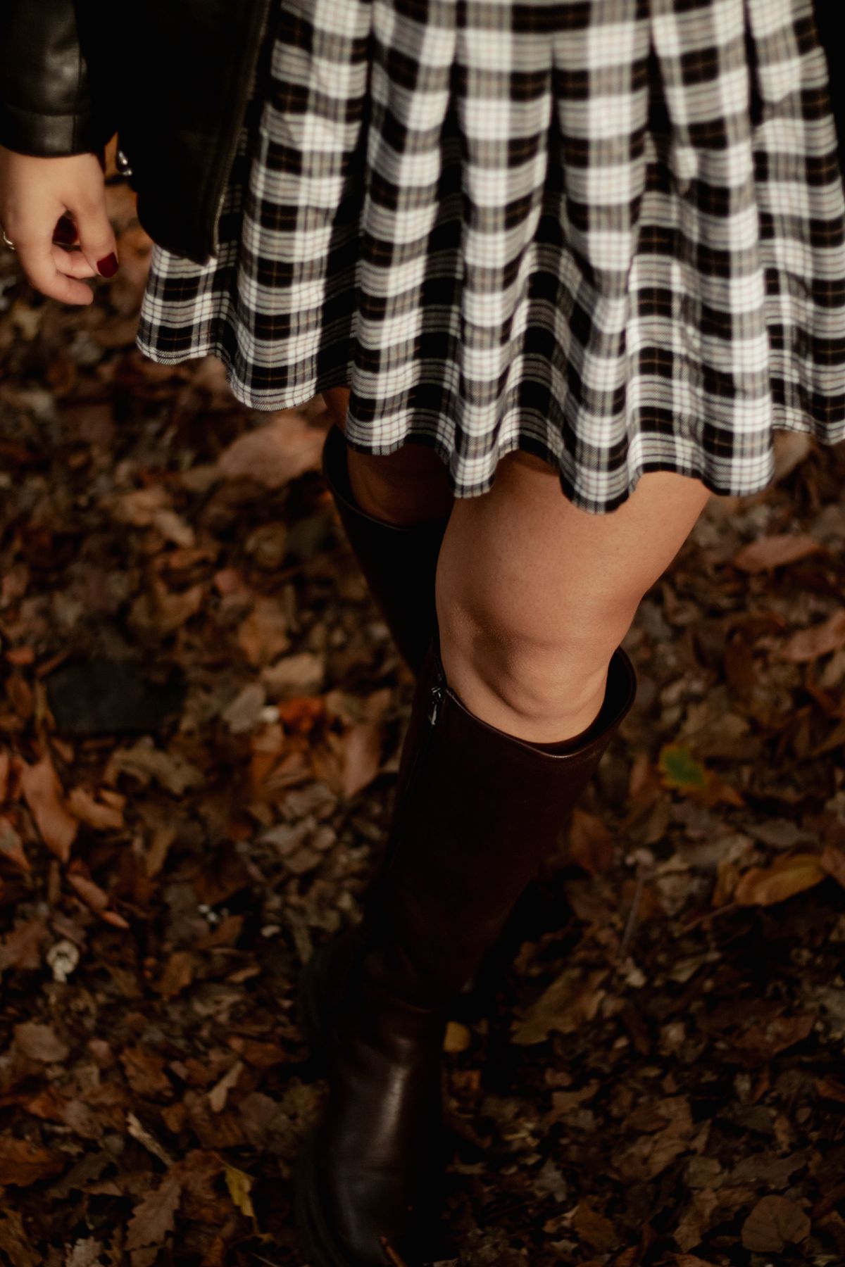 Equestrian Outfits for Women — 7 Riding Boots and Heritage Looks for Fall Woman in an equestrian blazer and tall boots
