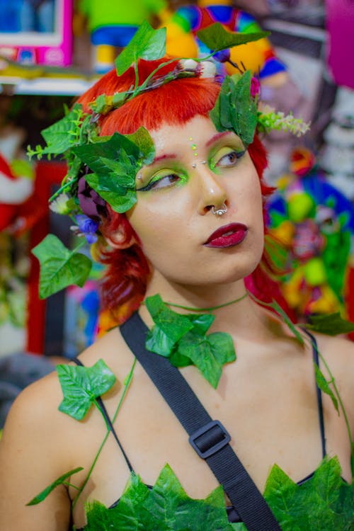 Redhead Model Wearing Glamour Makeup with Leaves