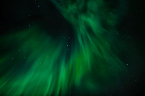 Free Stunning aurora borealis lights up the night sky over Nusfjord, Norway, creating a magical celestial display. Stock Photo