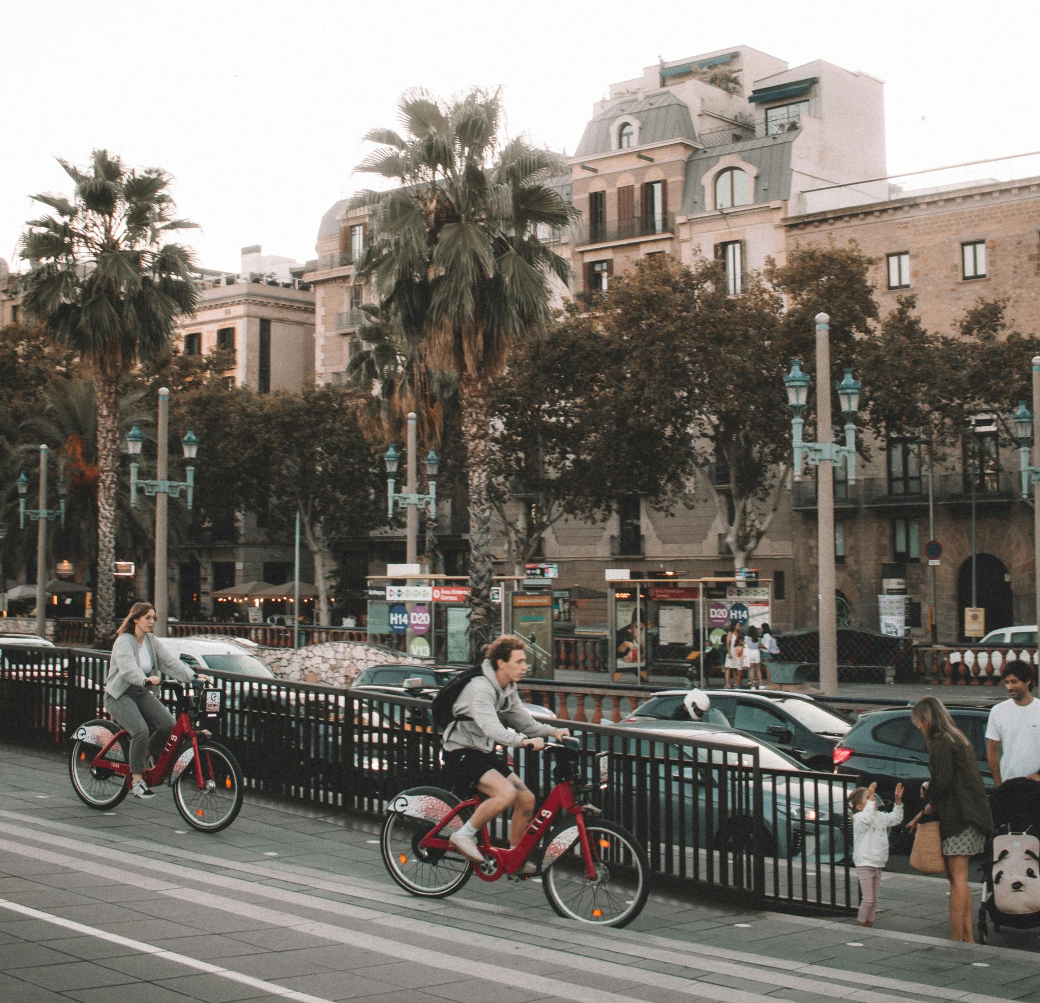 people riding on bikes in barcelona