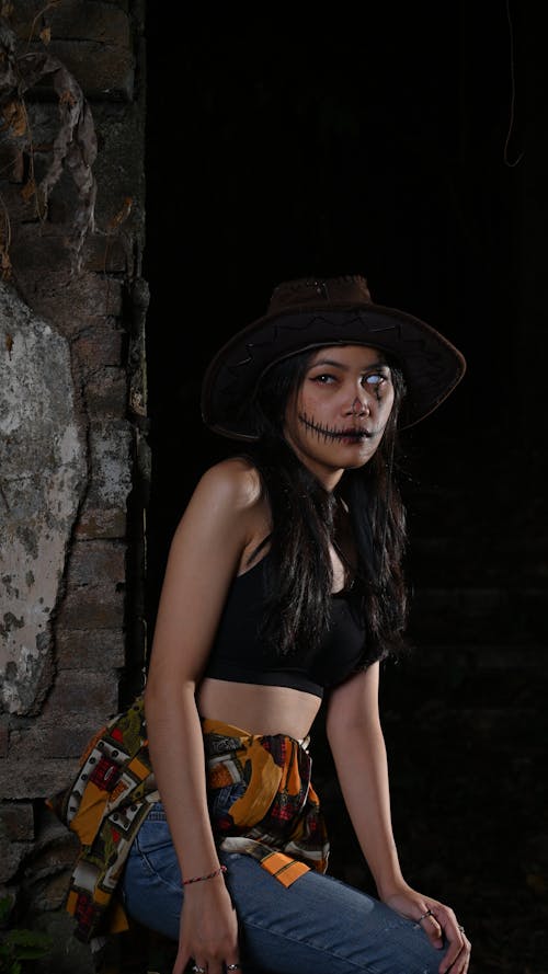 Woman with Painted Face for Halloween and in Black Top