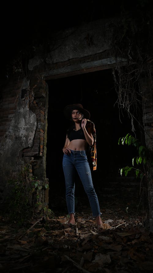 Woman Posing in a Temple in the Dark 