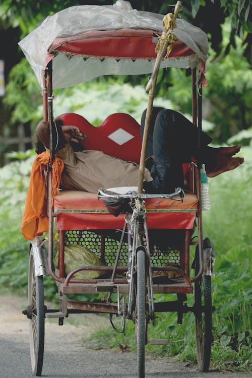 Man Resting in Rickshaw