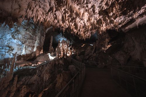 Free Capture of a breathtaking limestone cave with stalactites and stalagmites. Stock Photo