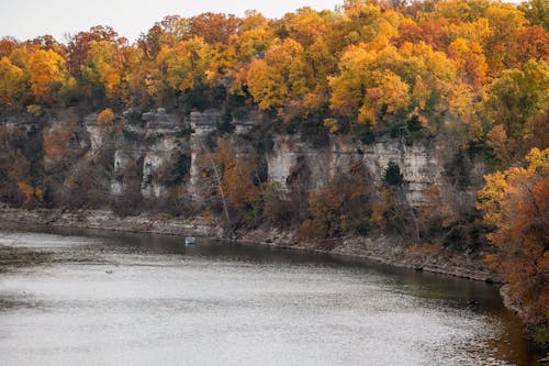 View of Cliffs and Autumnal Leaves on the Bank of the Spring River in Oklahoma, USA