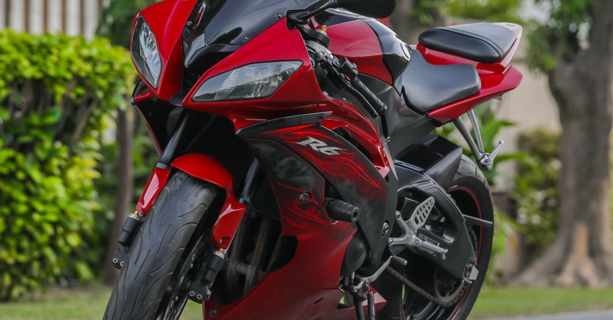 Red Yzf R6 Red Yamaha YZF-R6 Motorcycle Parked on Street · Free Stock Photo