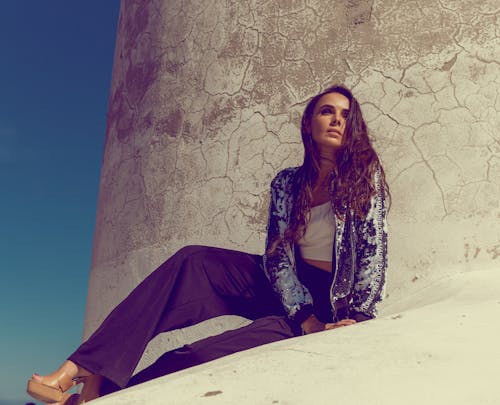 Brunette Woman Posing on a Stone Roof 