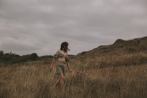 Woman in Bra Walking in Countryside