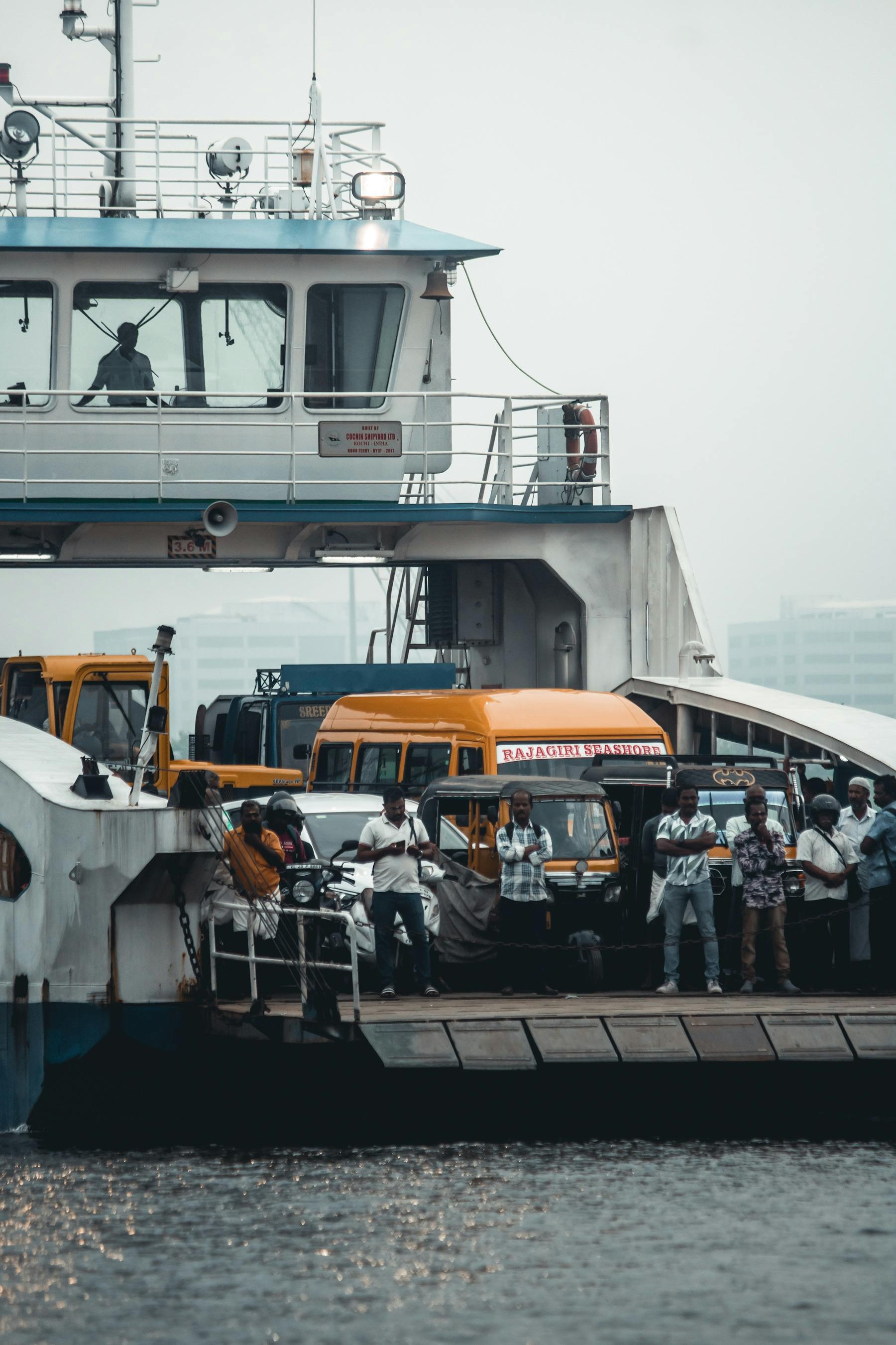 people and cars on ferry
