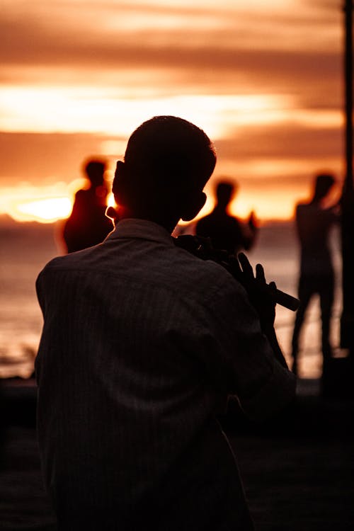 Silhouette of Flutist at Sunset