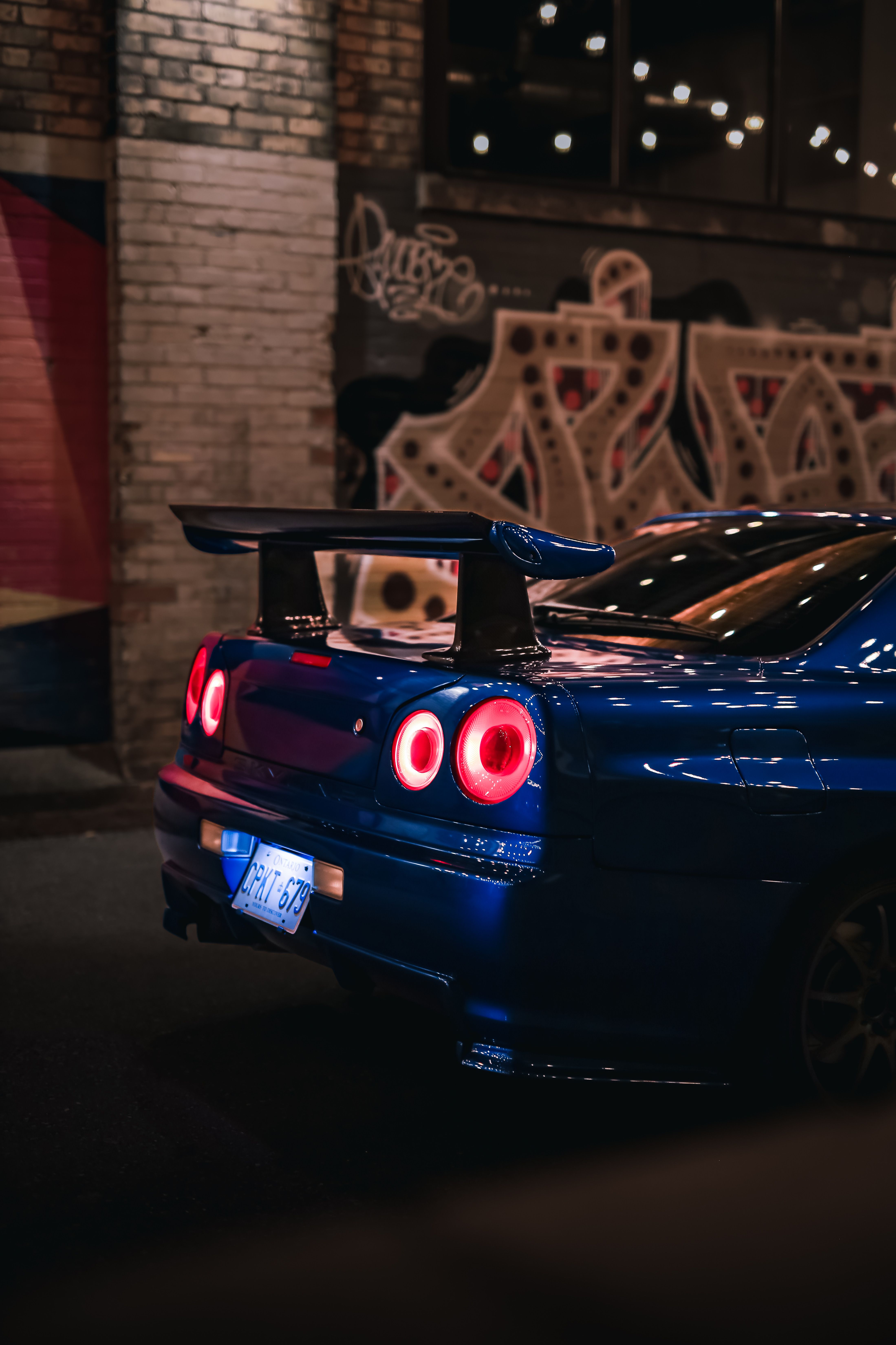 Blue Nissan Skyline R34 GTR at Night · Free Stock Photo