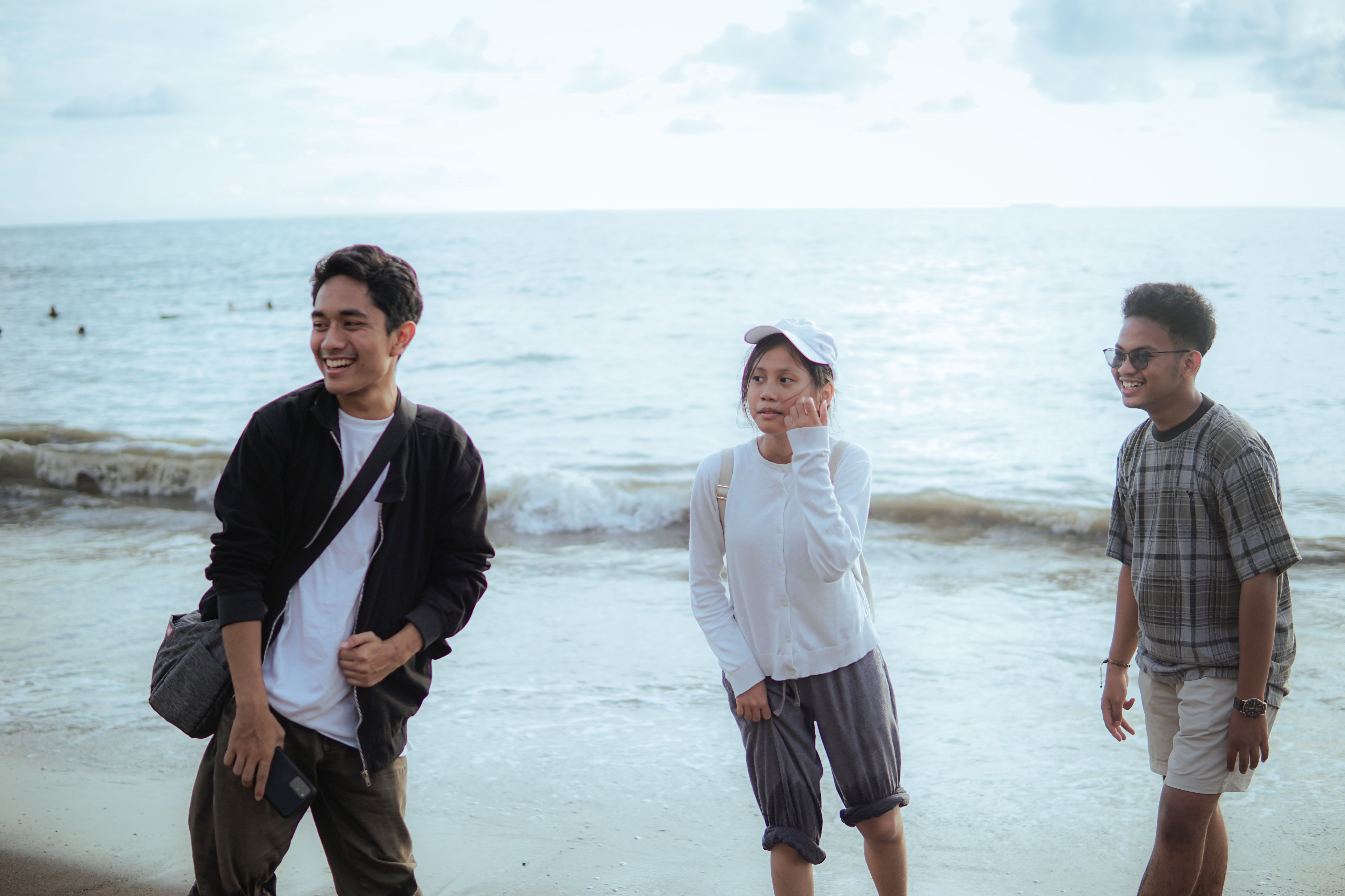 Group of People Posing on a Beach · Free Stock Photo