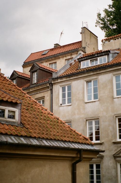 Free Picturesque view of red-tile rooftops in Warsaw's Old Town, Poland. Stock Photo