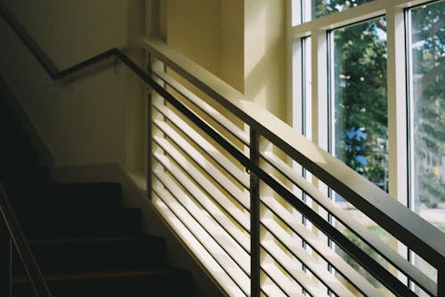 Staircase with Railing by the Window in a Building 
