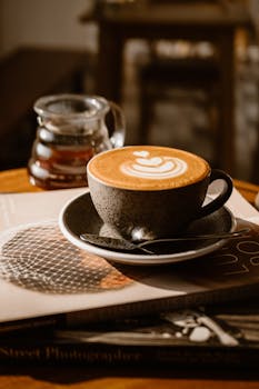 Cappuccino with elegant latte art served in a cozy café setting, perfect for coffee enthusiasts.