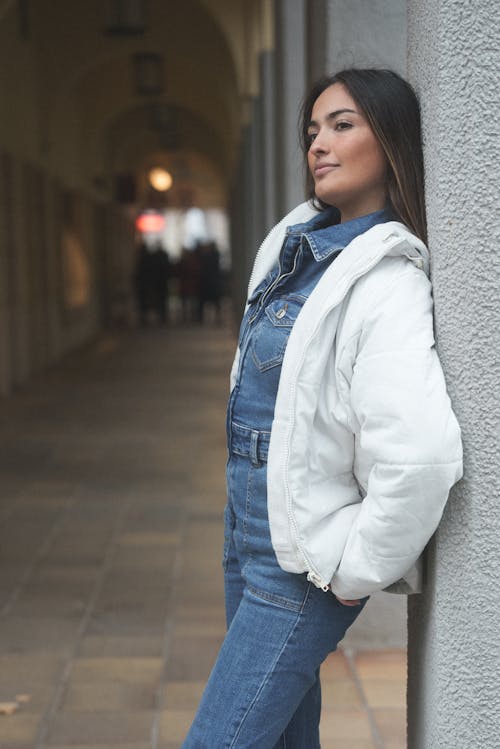 Woman in Jacket Leaning on Wall