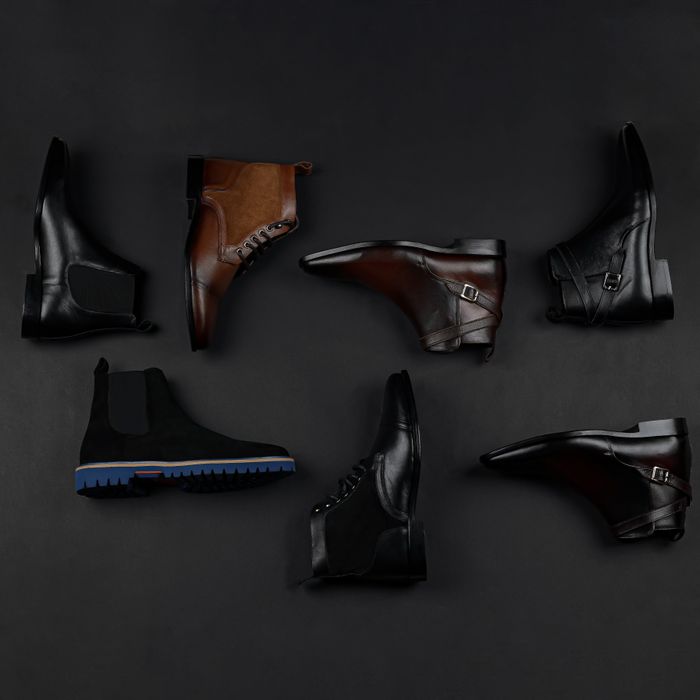 Men's leather shoes on a dark studio backdrop — photo by Danyal Malik on Pexels