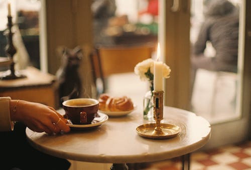 Woman Drinking Coffee in a Restaurant 