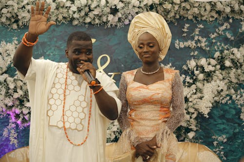 Man in T-Shirt and Bride in Dress