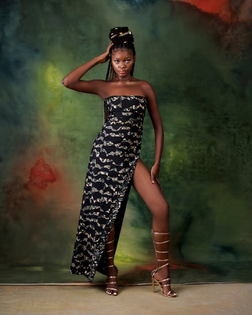 African Woman Posing in Patterned Dress