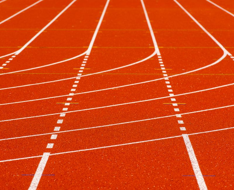All-natural performance patches displayed against a vibrant athletic backdrop