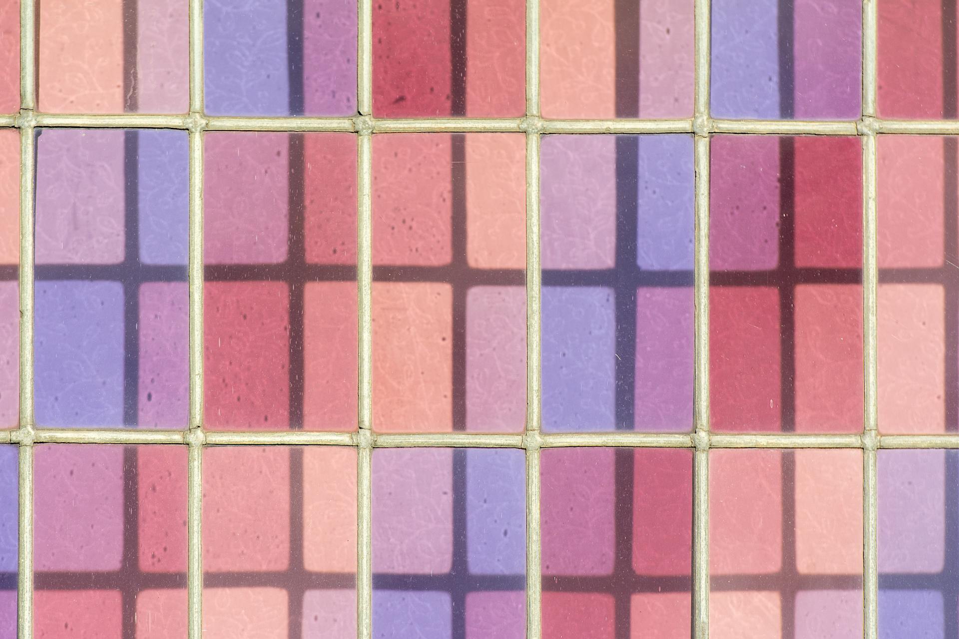 A vibrant grid pattern with pastel colors and mesh overlay, perfect for artistic and abstract design use.