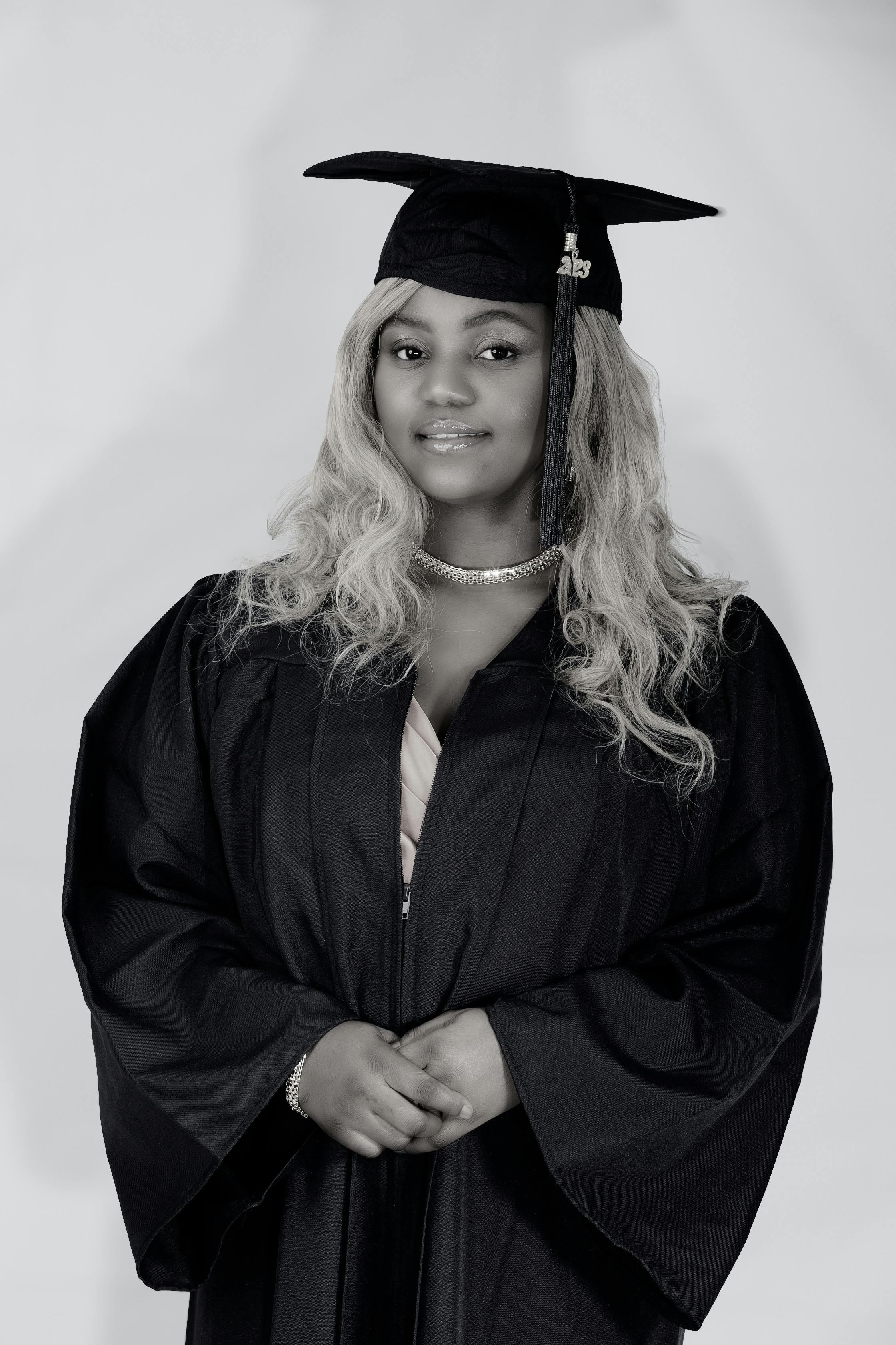 A person wearing a graduation gown and a hat photo – Free Algeria Image on  Unsplash