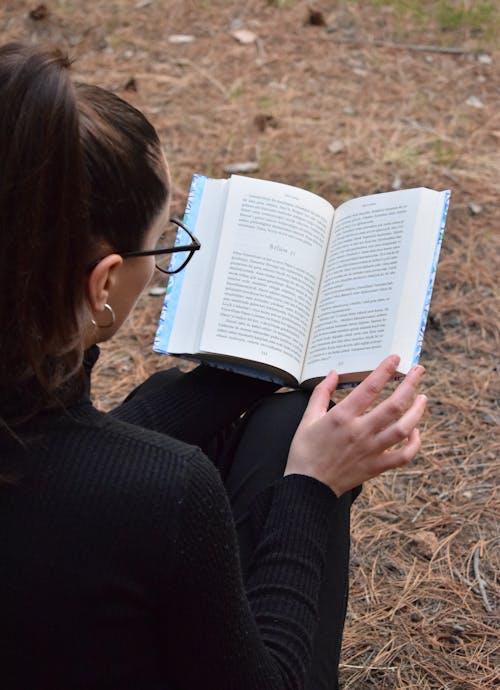 Brunette Woman Reading Book