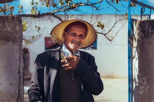 Elderly Man Wearing Straw Hat 