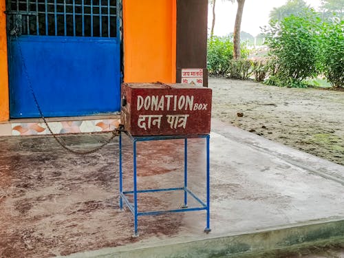 A donation box sits outside a building