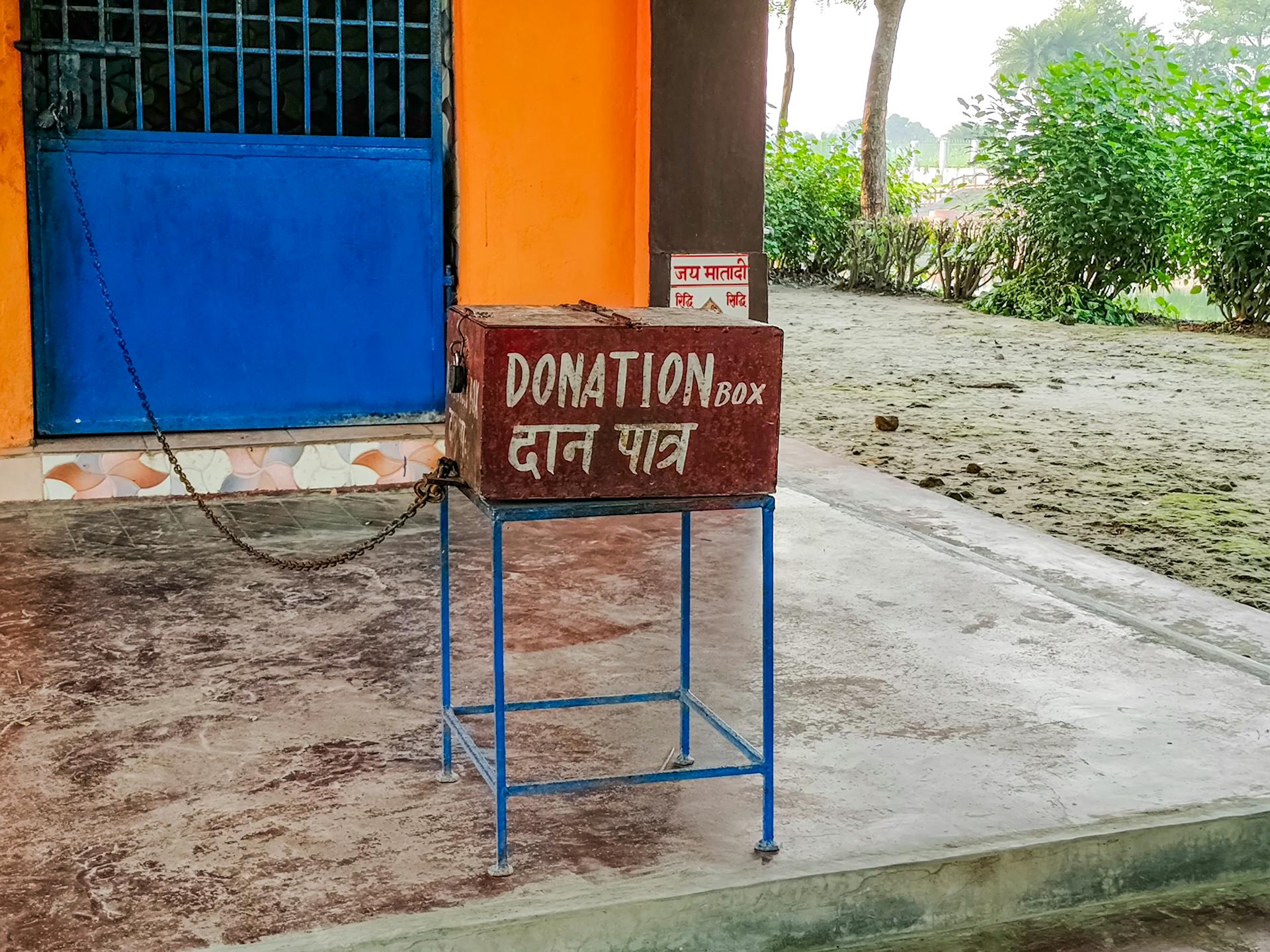 A donation box sits outside a building