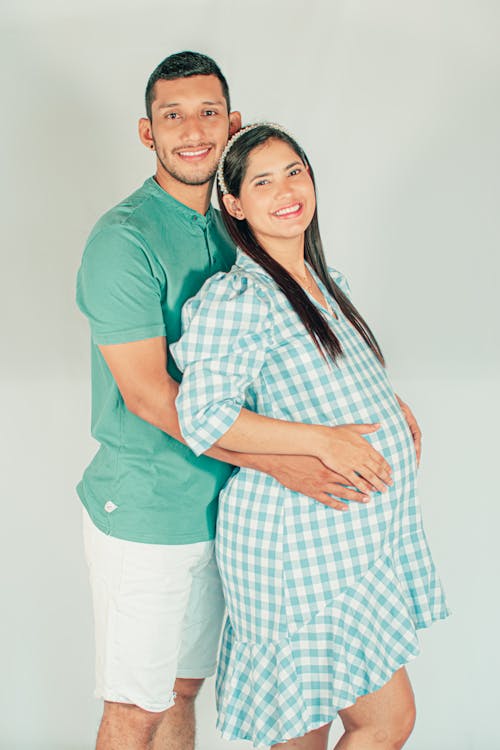 Photo of a Smiling Pregnant Couple 