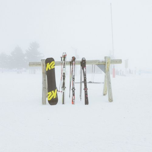 Free Ski and snowboard gear in fresh winter snow at Les Deux Alpes, France. Stock Photo