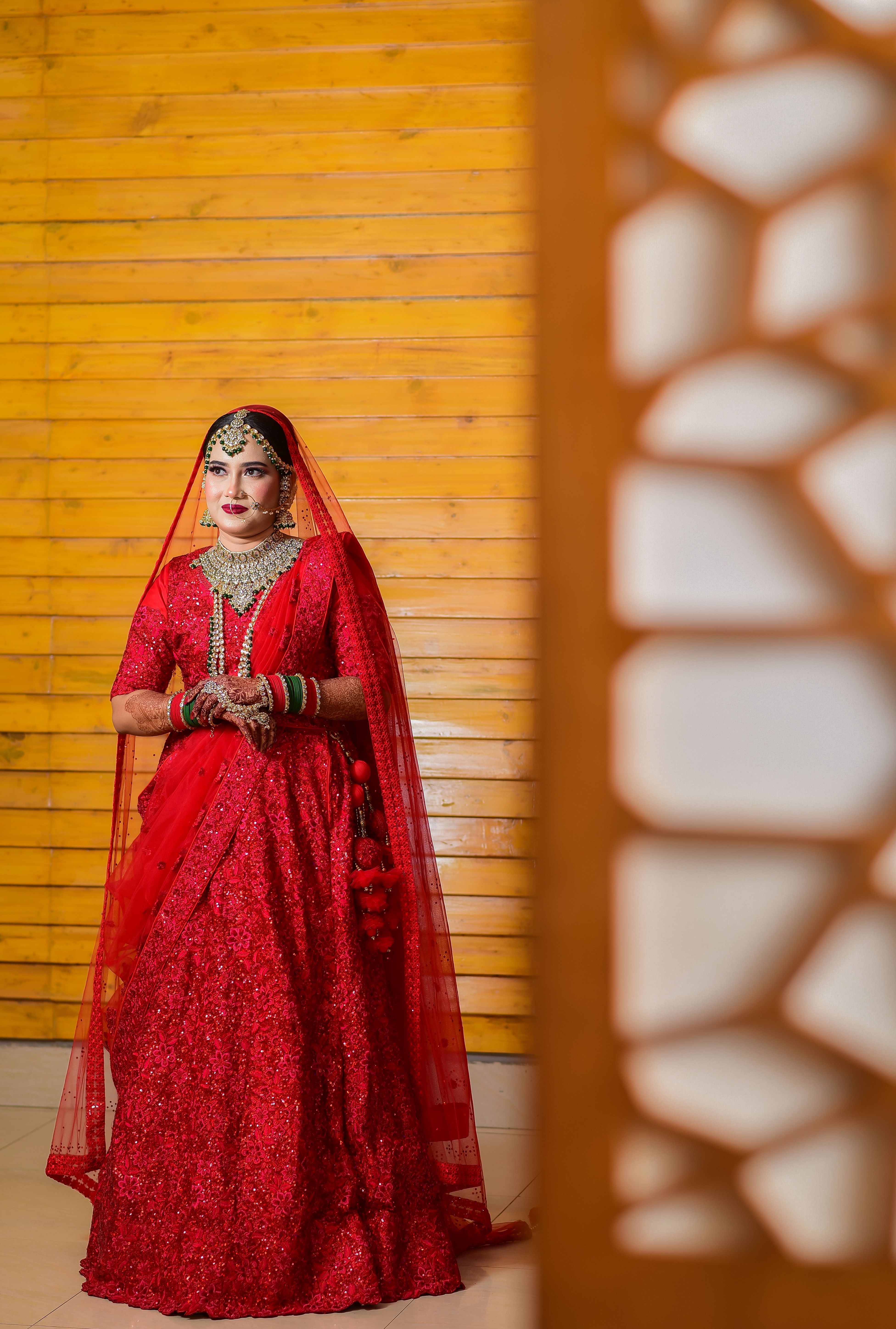 Bride Wearing Traditional Jewelry to Red Dress  Free Stock Photo