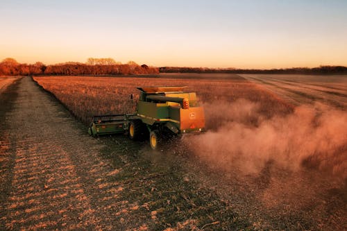 View of a Combine Harvester on a Cropland 