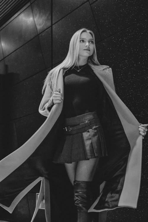 Model in a Wool Coat and Pleated Mini Skirt