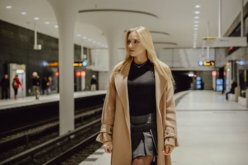 Blonde Woman in Coat in Metro Station