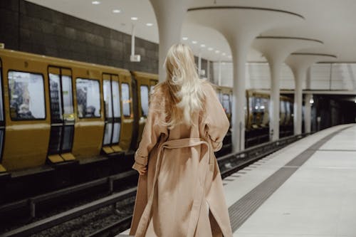 Back View of Blonde Woman in Subway Station