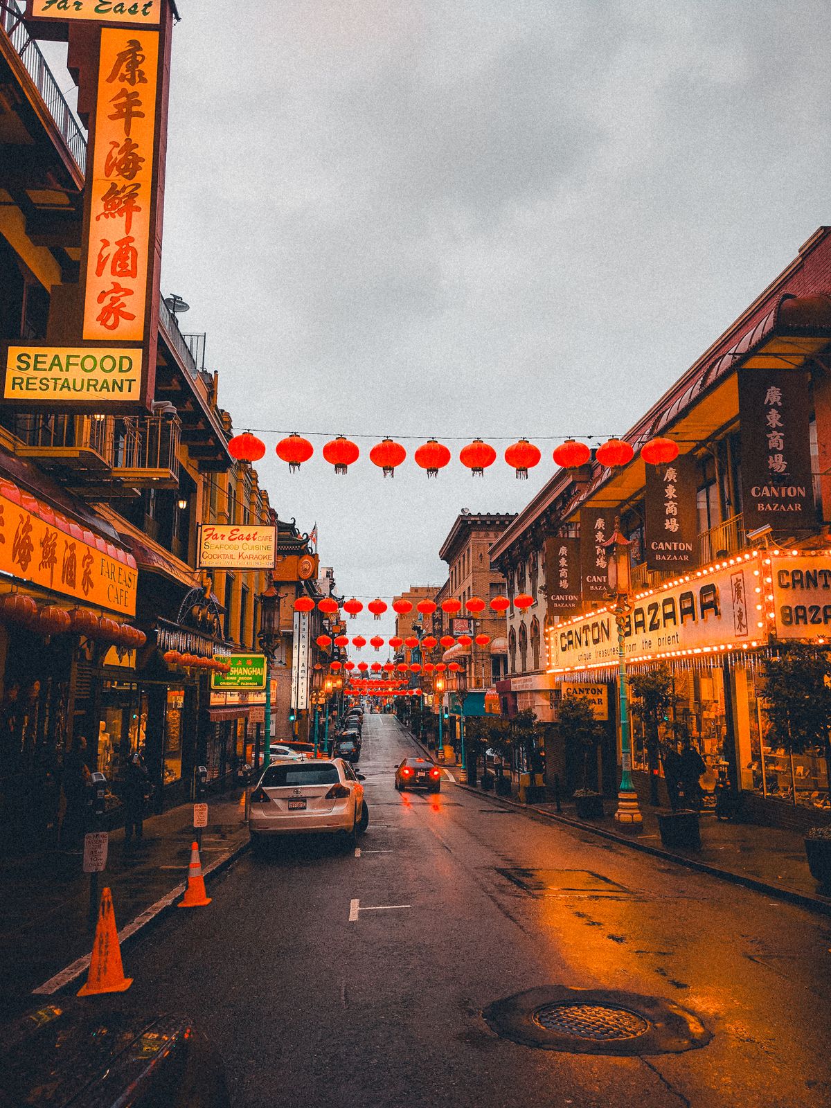 Paper lanterns hung over a street in San Francisco's Chinatown between Far East Cafe and Canton Bazaar