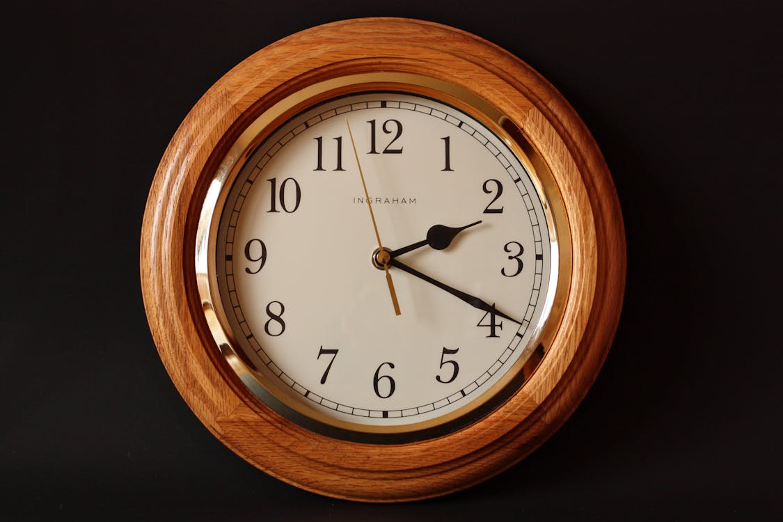 Free Brown Wooden Framed Clock Showing 2:19 Stock Photo